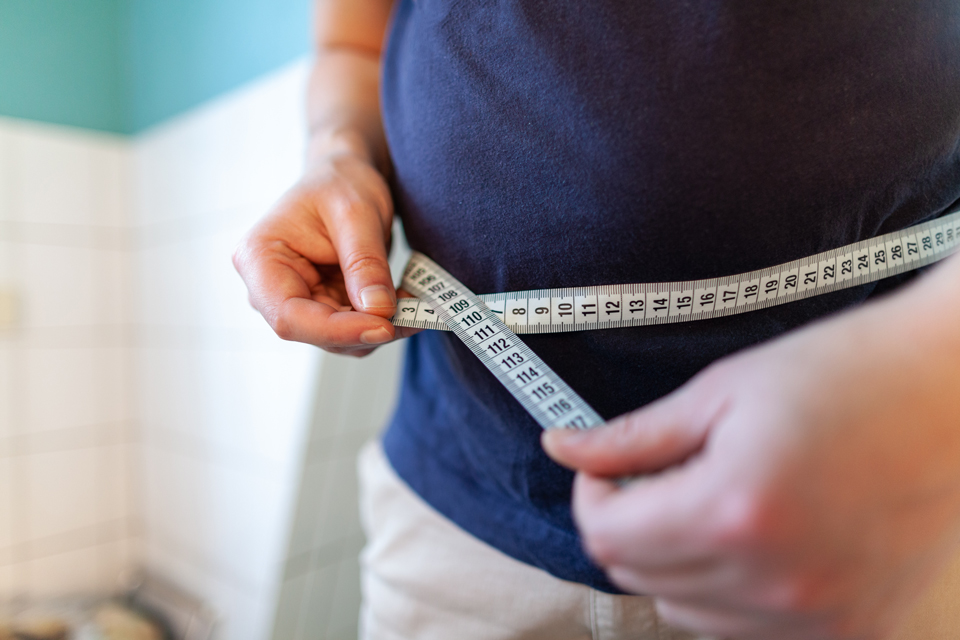 Person measuring circumference