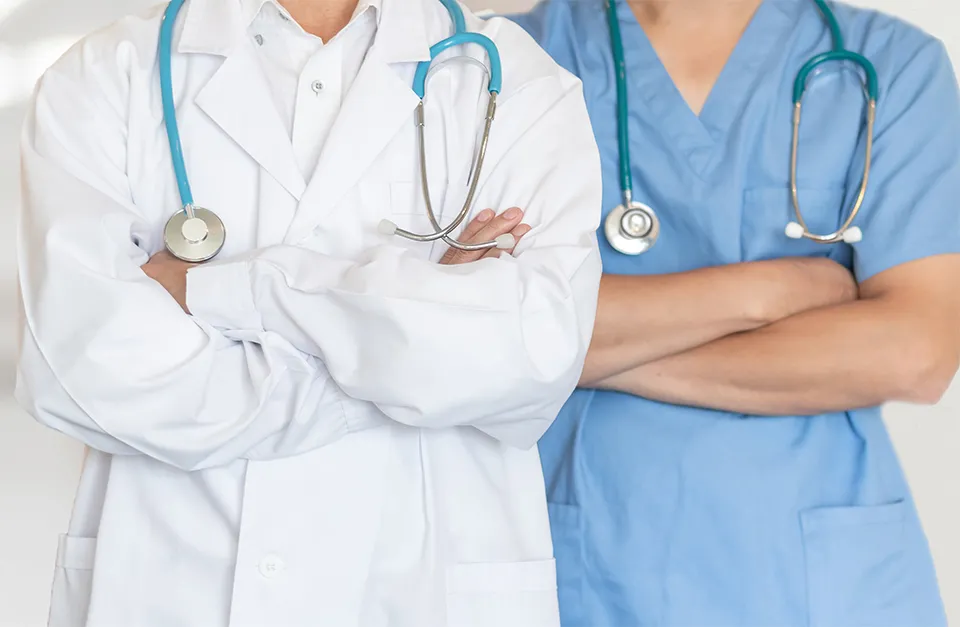 Two doctors with arms crossed